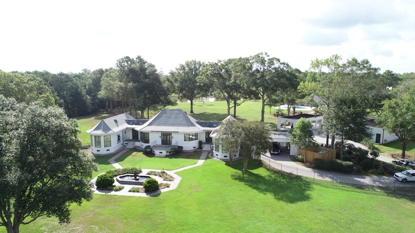 Aerial of the main residence, parking and pool house