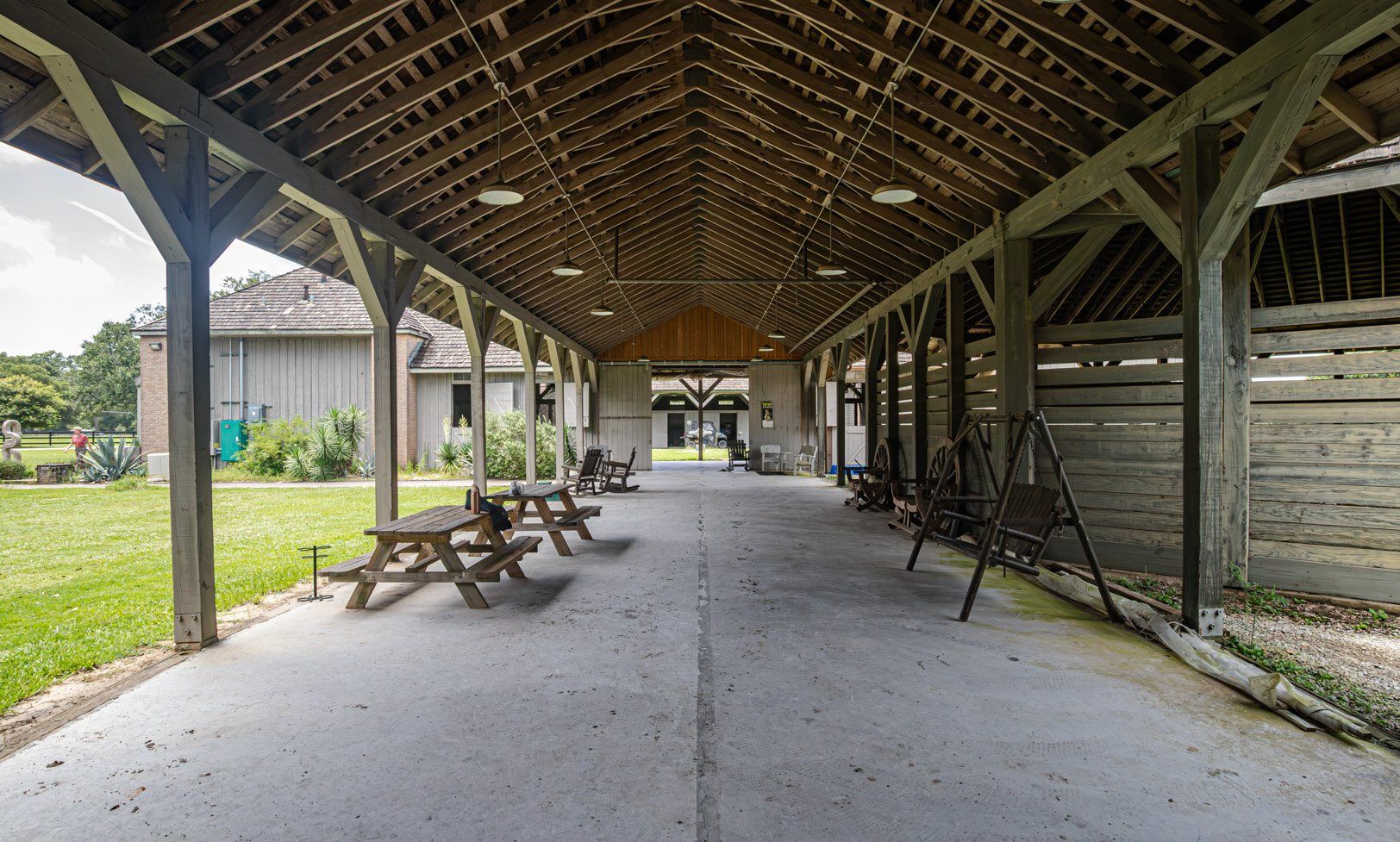 Covered timber breezeway running the length of the stable