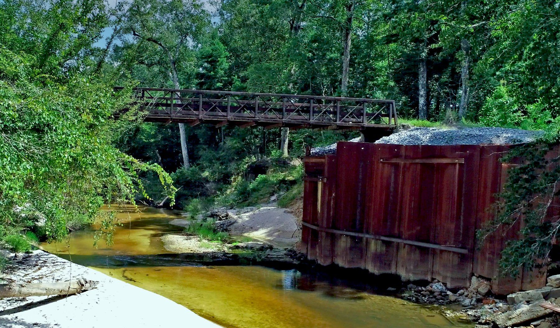 The substantial bridge crossing the Bogue Falaya River