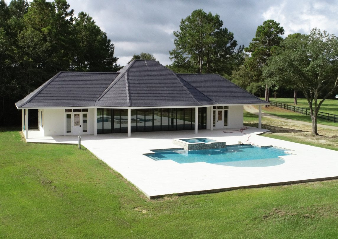 Pool house and pool with completed exterior and slate roof